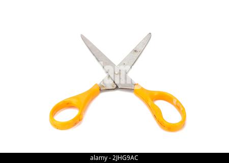 orange scissors. dirty. isolated no white background. Stock Photo