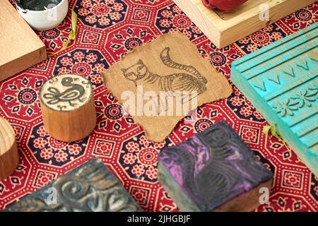 Wooden stamps for medieval ink printing on fabric and vintage clothing. Reconstruction of the events of the Middle Ages in Europe. Stock Photo