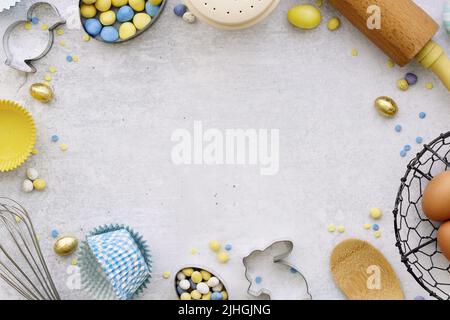 Easter baking background with Easter baking utensils and Easter eggs Stock Photo