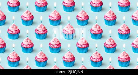 Seamless background repeating pattern of birthday cupcakes decorated with a birthday candle Stock Photo