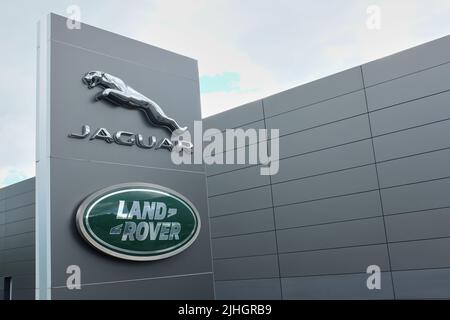 Kentdale Jaguar Land Rover garage with the Jaguar and Land Rover brand names and logos prominently displayed Stock Photo