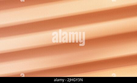 Beige textured cardboard with striped windows shadows close up. Large texture and background Stock Photo
