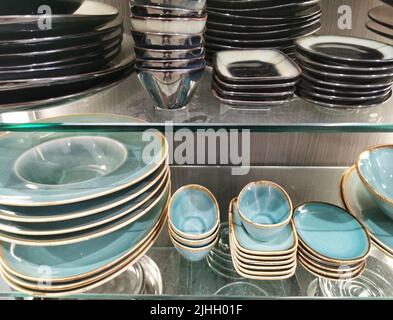 Stacks of tableware in a shop Stock Photo