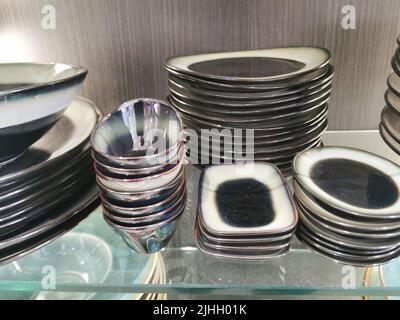 Stacks of tableware in a shop Stock Photo