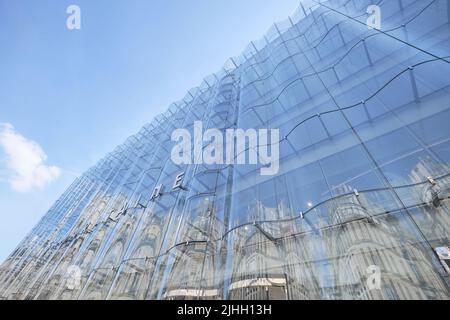 Paris, France - May 18, 2022: La Samaritaine luxury department store and its new undulating glass facade designed by studio SANAA Stock Photo