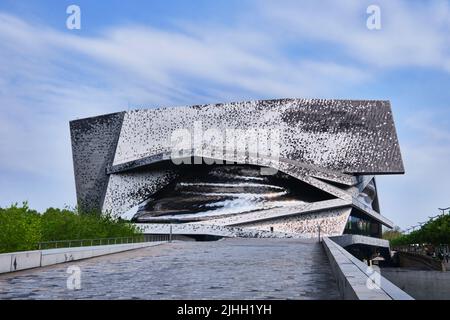 Paris, France - May 4, 2022: View of Paris Philharmonic (Philharmonie de Paris) and facade details in Parc de la Villette. Designed by Jean Nouvel. Co Stock Photo