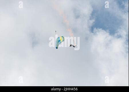 Gothenborg, Sweden - August 29 2009: Person performing a parachuting display with smoke. Stock Photo