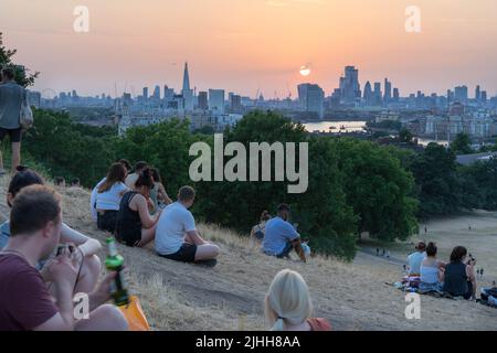 London UK, 18th July 2022.  UK Weather. People enjoy beautiful sunset on extremely hot summer Monday in London as UK prepares for Extreme heat national severe weather covering Monday and Tuesday  in England UK. Credit: Xiu Bao/Alamy Live News Stock Photo