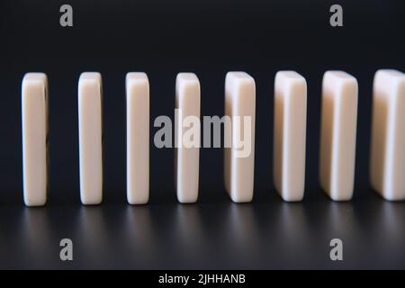 Domino effect. Conceptual photo. Dominos standing close to each other. Stock Photo