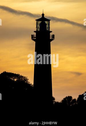 A beautiful Sunset over the lighthouse Stock Photo