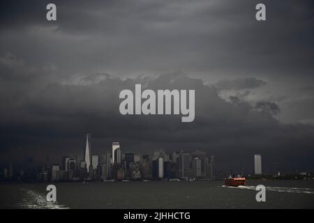 New York, US. 18 Jul 2022.  Staten Island Ferry heads north towards Manhattan as NYC Department of Transportation reduces ferry schedule citing rise in COVID-19 cases; DOT says modified schedule will be in effect through July 26.   New York City’s Health Department says 7-day average number of cases has doubled since April. Stock Photo