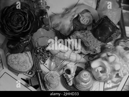 A collection of items likely found in someone's trinket box, or a goblin's pockets. Tarot card background. Stock Photo