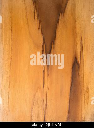 abstract of wood board surface with grain, beautiful and unusual yellowish brown color hardwood with natural pattern background texture, wallpaper Stock Photo