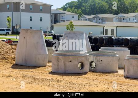 Concrete pipes to construct drainage systems on large cement drainage pipes for industrial building construction Stock Photo