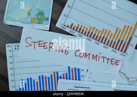 Concept of Steering Committee write on sticky notes isolated on Wooden Table. Stock Photo
