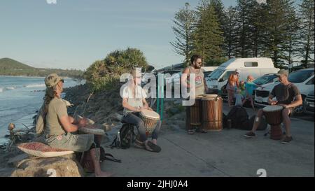 BYRON BAY, AUSTRALIA - NOV 3 2021: wide shot of a drum ensemble playing african drums at byron bay Stock Photo