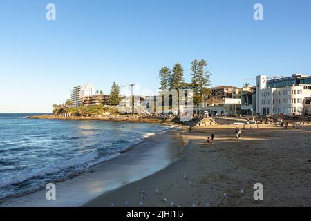 People enjoying a warm winter day on South Cronulla Beach Stock Photo