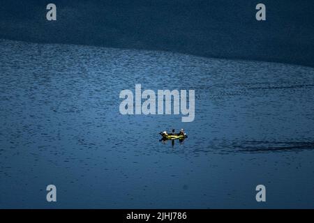 Waldeck, Germany. 19th July, 2022. Anglers are out on a boat on the Edersee. The third largest reservoir in Germany is 46 percent full. Credit: Swen Pförtner/dpa/Alamy Live News Stock Photo