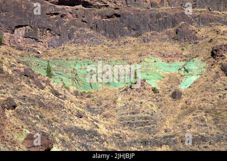 Turqouise green layer of iron hydrate, deposits in the rock, Azulejos, Grand Canary, Canary islands, Spain, Europe Stock Photo