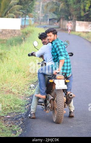 Two friends posing on a motorbike. Concept- travel and friendship Stock Photo