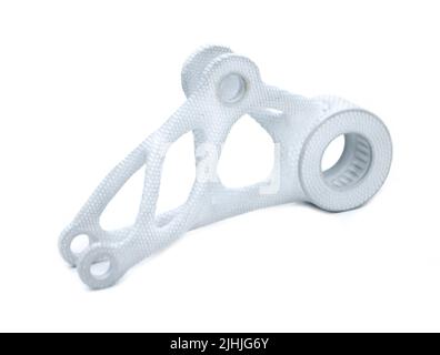 Model printed on 3D printer isolated on white background. Object detail printed on 3D printer from white plastic close-up. Prototype of shape made by 3d printer. Concept new modern printing technology Stock Photo