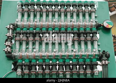 Plastic pipes, connections and pressure gauge for irrigation system or spraying agricultural fields and crops on industrial machinery. Stock Photo