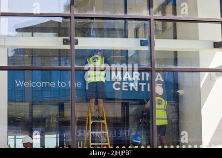 18th July 2022. Great Yarmouth, Norfolk. Working through the blistering heatwave to put finishing touches to Great Yarmouth's new Marina Centre, due to open in August.  The sports and leisure centre replaces the former Marina Centre which opened in 1981. Stock Photo