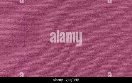 Angora cozy pink knitted fabric texture. Knitting purple pink texture of sweater close up. Stock Photo