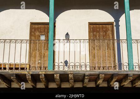 Typical balconies in the central square of Chinchon in Madrid, old wooden balconies in all the houses. Spain. Stock Photo