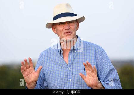 EDITORIAL USE ONLY Trainer, John Gosden watches his horse, Stradivarius train up the Warren Hill Gallops in Newmarket as they prepare to attempt a record fifth Group 1 Al Shaqab Goodwood Cup win next week. Picture date: Tuesday July 19, 2022. Stock Photo