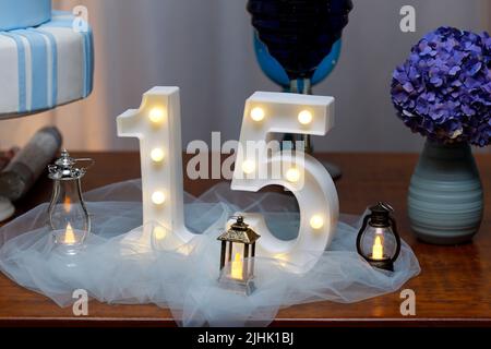 number fifteen with lights at 15th birthday party - light party Stock Photo