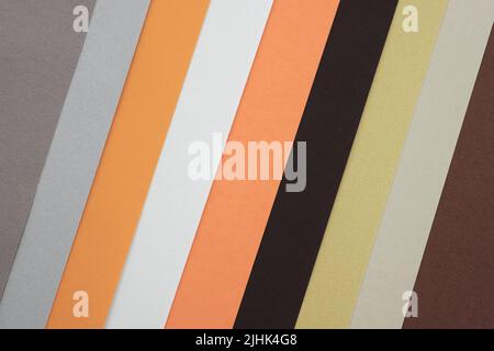 Sheets of orange, black and gray paper, palette of colored paper. Abstract paper background diagonal lines. soft pastel colored empty space for text. Stock Photo