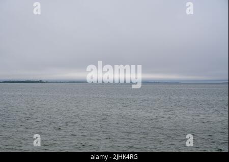View from the north shore at Cedardale over lake Ontario on a grey, overcast day with low clouds in Prince Edward County, Ontario, Canada. Stock Photo