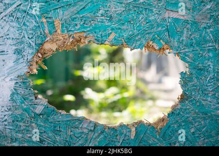 Close up of old wood fence with a hole Stock Photo