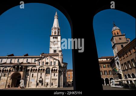 View of the Cathedral of Modena (Duomo di Modena) with the Civica Tower in Piazza Grande during a summer day. Stock Photo