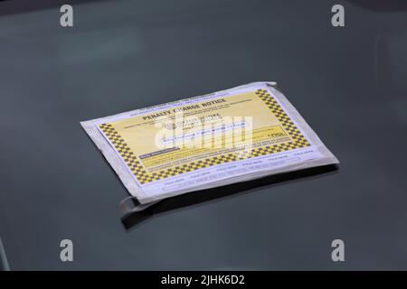 Penalty Charge Notice on car windscreen at Oxford, Oxfordshire UK on a wet rainy day in August Stock Photo