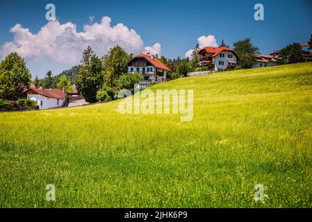 Mountain houses in the meadows. Soprabolzano, small and picturesque village. Soprabolzano, Oberbozen in German, is a small town in the province of Bol Stock Photo