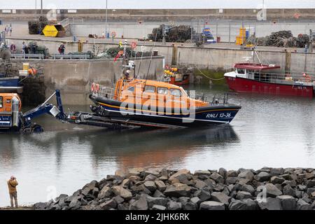 Training exercise launch of Shannon Class Lifeboat RNLB 13-36 John and Elizabeth Allan at Seahouses Harbour, North Sunderland, England Stock Photo