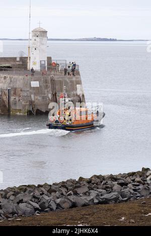 Training exercise launch of Shannon Class Lifeboat RNLB 13-36 John and Elizabeth Allan at Seahouses Harbour, North Sunderland, England Stock Photo