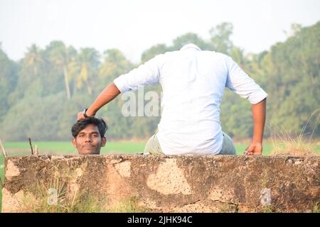 Two young men posing for photo in a creative way. Concept- creative photography Stock Photo