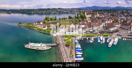 Rapperswil-Jona medieval town and castle on Zurich lake, Switzerland, is a popular tourist destination from Zurich. aerial panoramic view Stock Photo