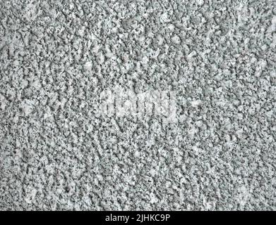 abstract uneven textured concrete wall closeup, stone material texture closeup diversity Stock Photo