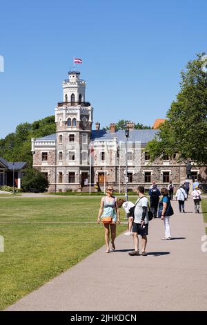 Tourists in summer visiting Sigulda Castle,  aka Sigulda New Castle, a 19th century neo-gothic architecture building; Sigulda, Latvia. Latvia travel. Stock Photo