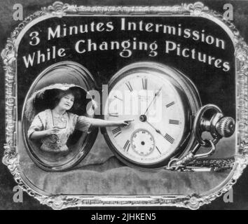 3 minutes intermission while changing pictures Photo shows woman pointing at pocket watch dial. Positive paper print from lantern slide used in motion picture theaters as announcement. Stock Photo