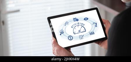 Efficiency concept shown on a tablet held by a man Stock Photo