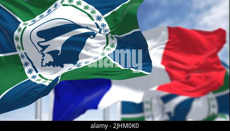 National flags of Martinique waving the flag of France on a clear day. Martinique is an island of the Antilles, French overseas department Stock Photo