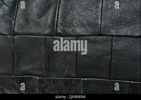 Pressed black leather pattern abstract background close up view Stock Photo