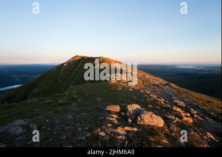The summit crag of Coniston Old Man seen from neighbouring Brim Fell, in the English Lake District Stock Photo