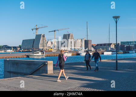 New apartments and offices buildings under construction on Papirøen, Paper island at the centre of the inner harbour of Copenhagen, Denmark, with girl Stock Photo