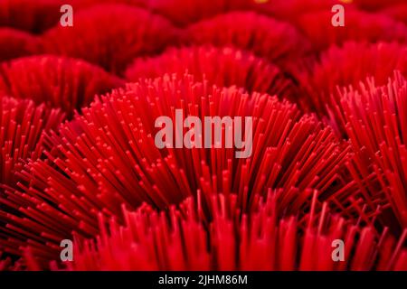 Workers crafting colorful plastic straws from pipes—pattern, texture, bright colors, labor, industry, reuse, straw making, plastic process Stock Photo